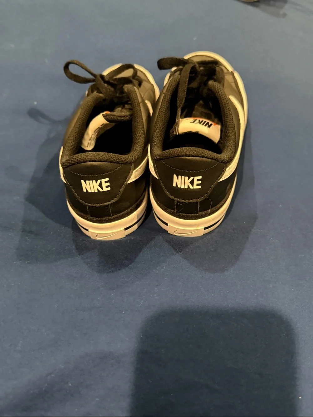 Nike Men’s Black Sneakers with White Swoosh and Cream Midsole